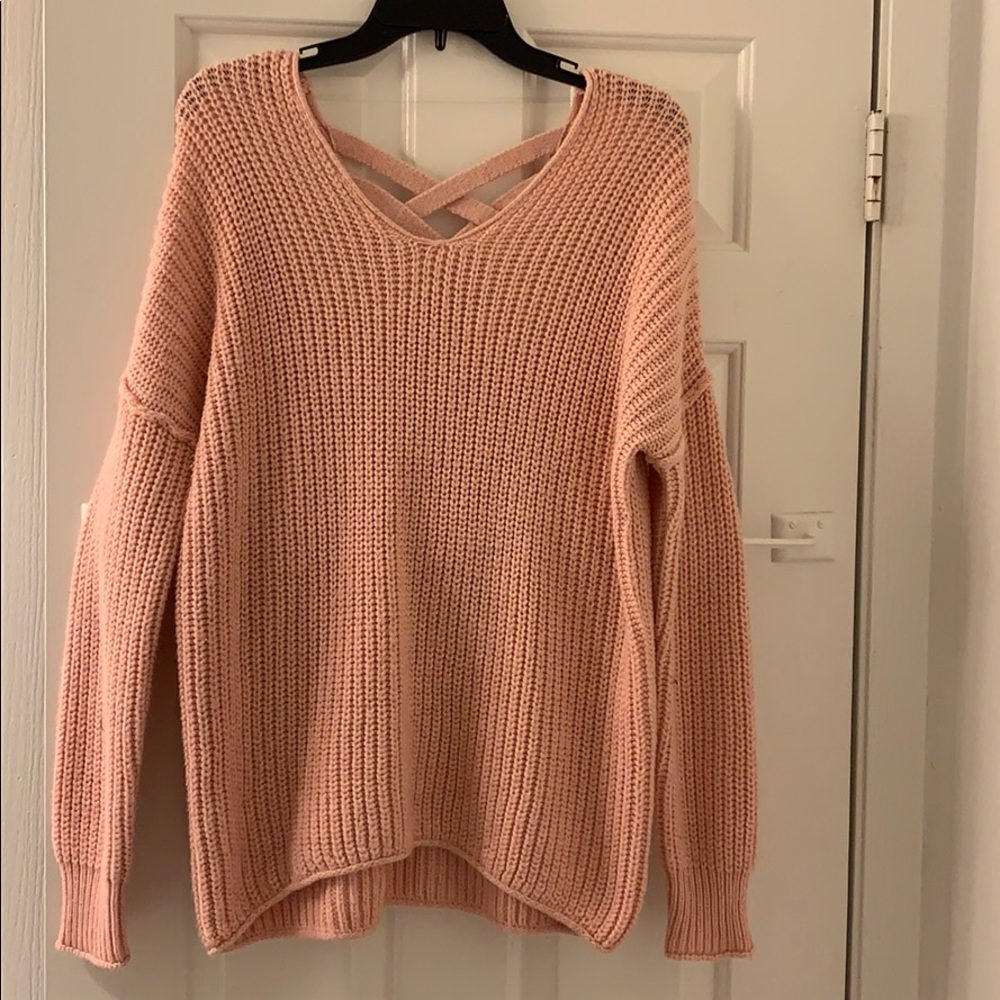 Pink thick knit sweater with crossing back detail